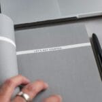 gray and white textbook, text "get started" is written in the book