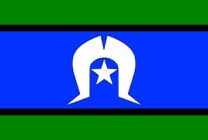 The Torres Strait Islander Flag, featuring horizontal stripes of green, blue, and green separated by thin black lines. In the center is a white Dhari (headdress) above a white five-pointed star.